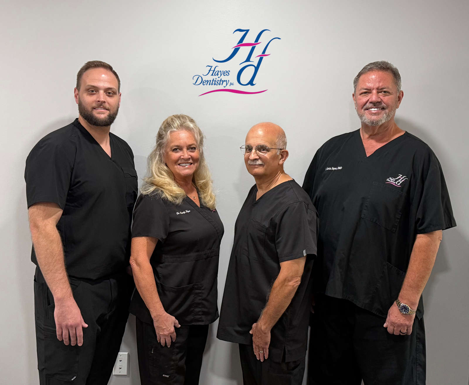 The four dentists of Hayes Family Dentistry in Cookeville, TN: Dr. Kevin Hayes, DMD, Dr. Sandra Hayes, DMD, Dr. Gerard DiFusco, DMD and Dr. Justin Ellis, DDS